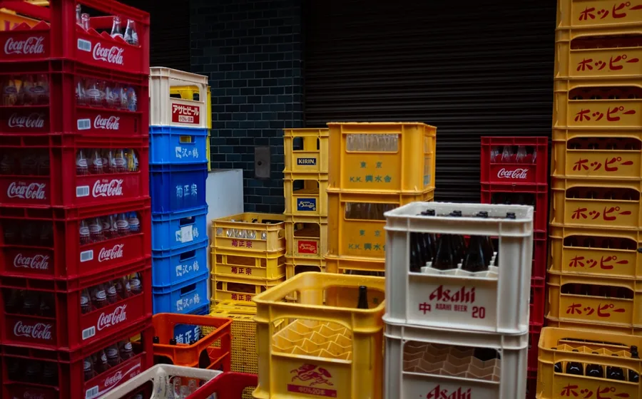Stacked beverage crates and bottled drinks in a food and drink wholesaler’s depot
